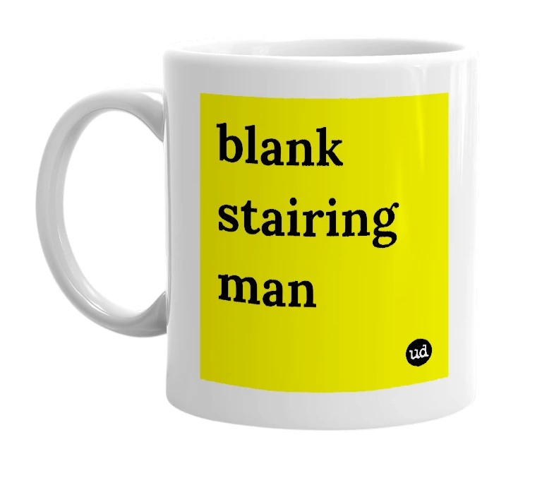 White mug with 'blank stairing man' in bold black letters