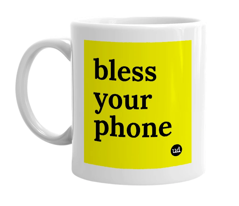 White mug with 'bless your phone' in bold black letters