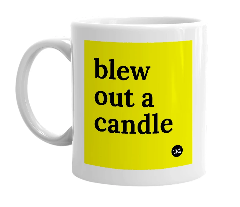 White mug with 'blew out a candle' in bold black letters