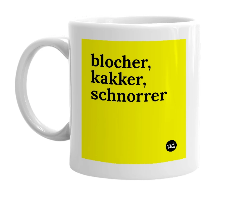 White mug with 'blocher, kakker, schnorrer' in bold black letters
