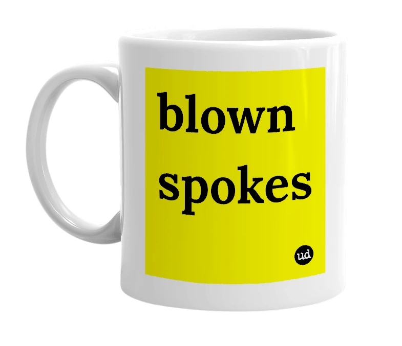 White mug with 'blown spokes' in bold black letters