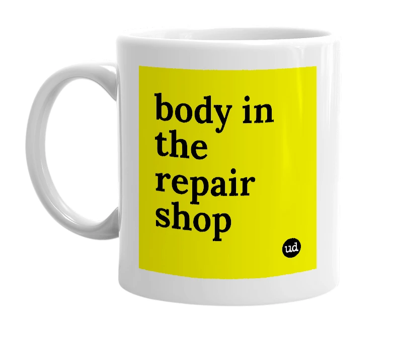White mug with 'body in the repair shop' in bold black letters