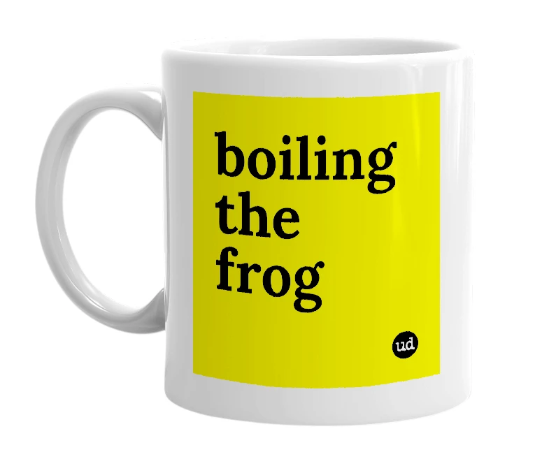 White mug with 'boiling the frog' in bold black letters