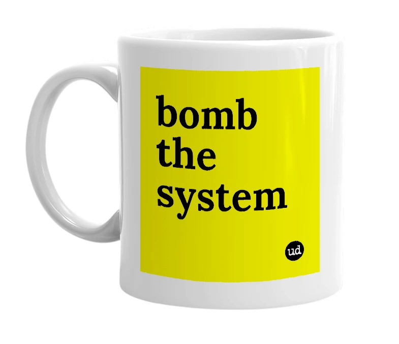 White mug with 'bomb the system' in bold black letters