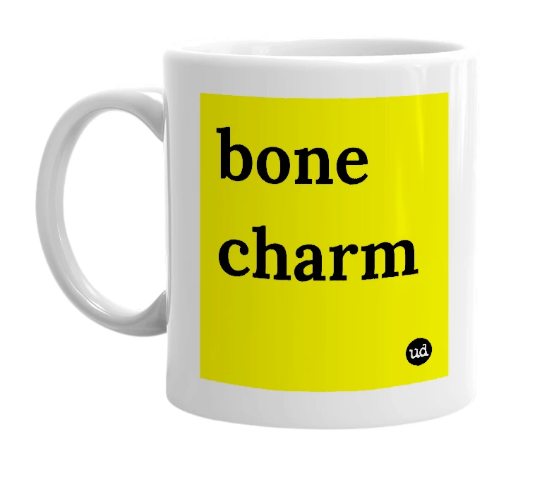 White mug with 'bone charm' in bold black letters