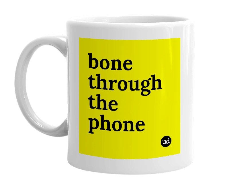 White mug with 'bone through the phone' in bold black letters