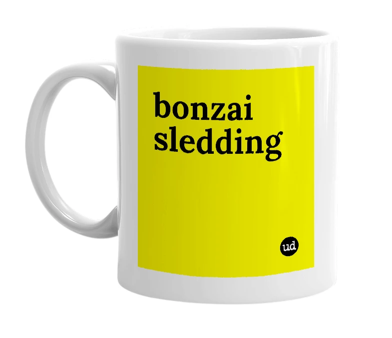 White mug with 'bonzai sledding' in bold black letters
