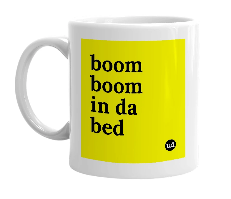 White mug with 'boom boom in da bed' in bold black letters