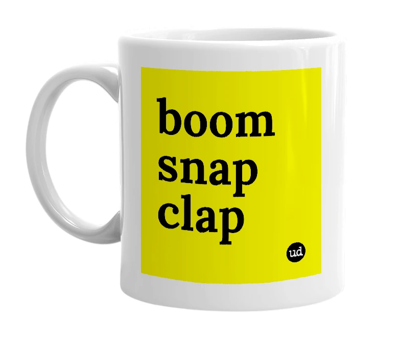 White mug with 'boom snap clap' in bold black letters