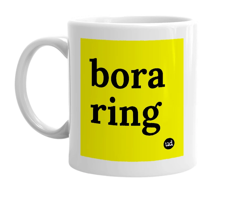 White mug with 'bora ring' in bold black letters