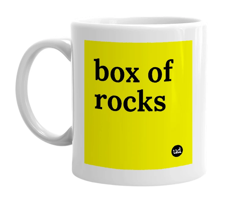 White mug with 'box of rocks' in bold black letters