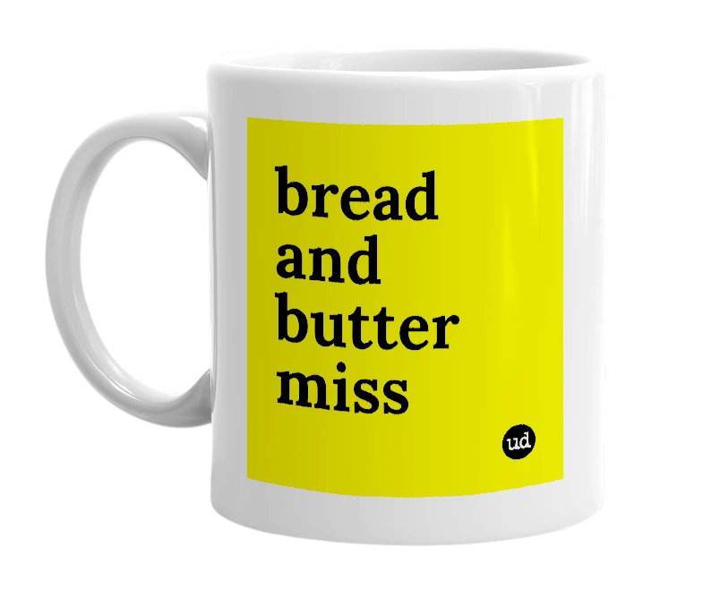 White mug with 'bread and butter miss' in bold black letters