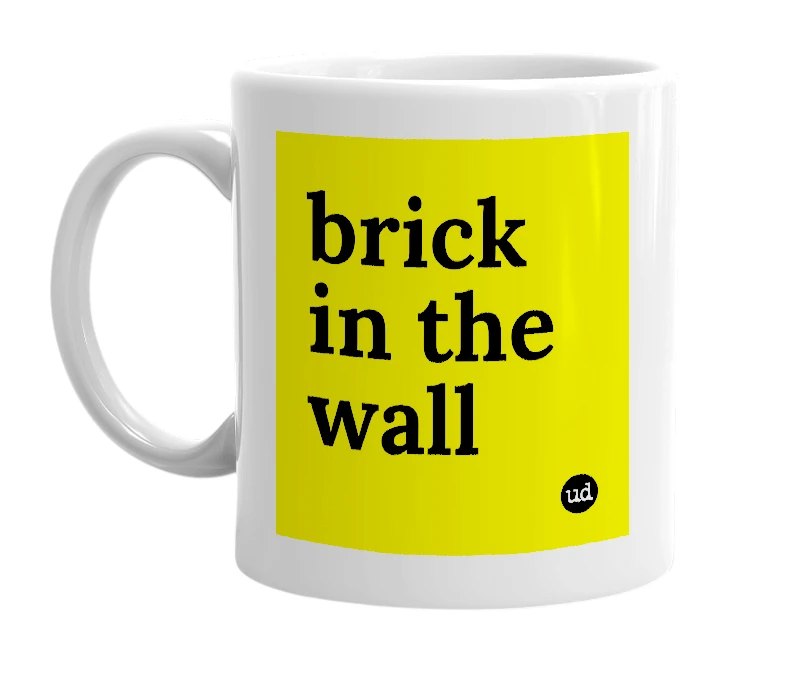 White mug with 'brick in the wall' in bold black letters