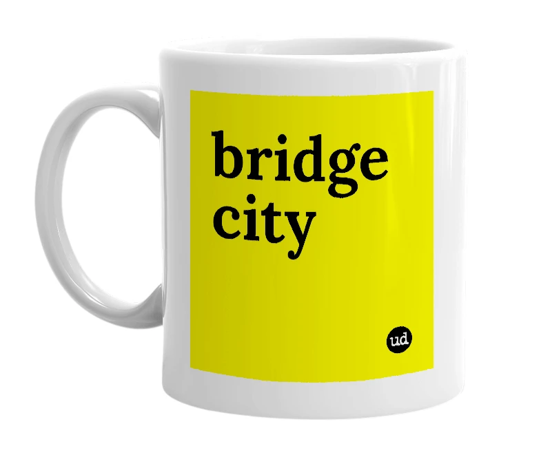 White mug with 'bridge city' in bold black letters