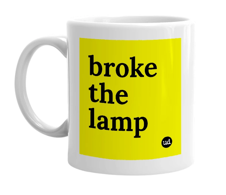 White mug with 'broke the lamp' in bold black letters