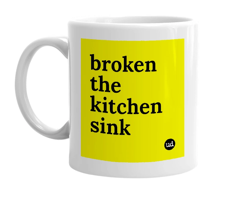 White mug with 'broken the kitchen sink' in bold black letters