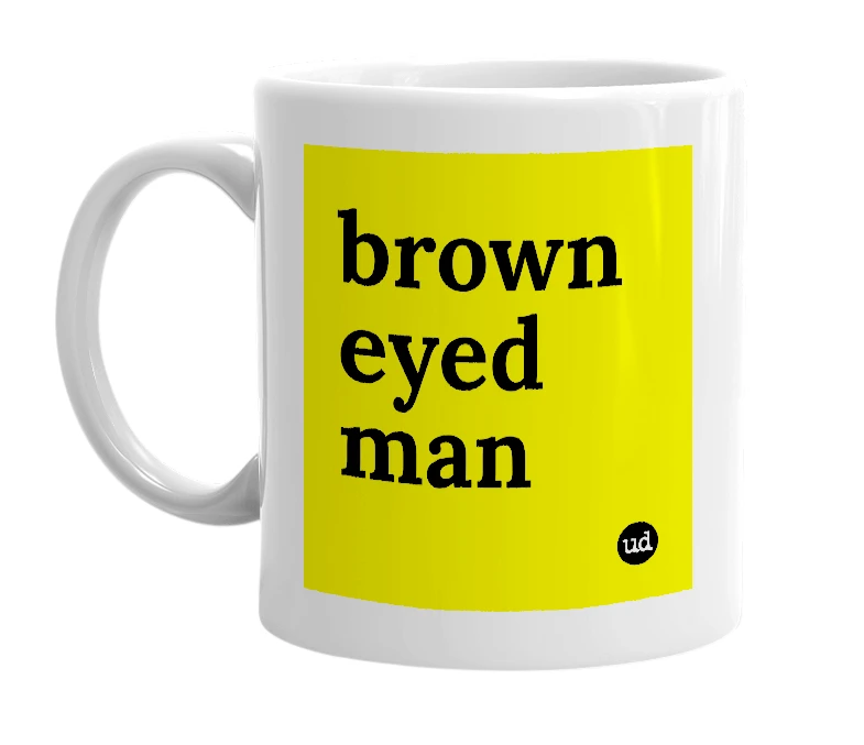 White mug with 'brown eyed man' in bold black letters