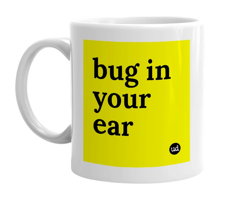 White mug with 'bug in your ear' in bold black letters
