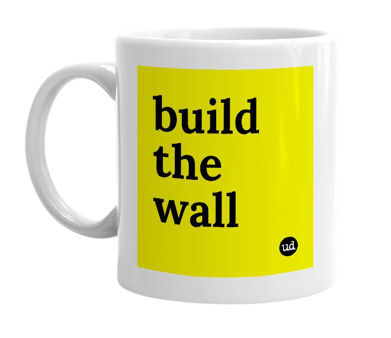 White mug with 'build the wall' in bold black letters