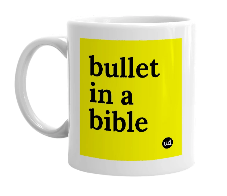 White mug with 'bullet in a bible' in bold black letters