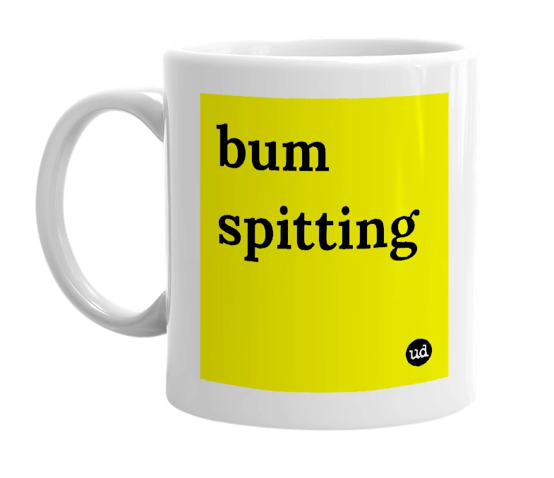 White mug with 'bum spitting' in bold black letters