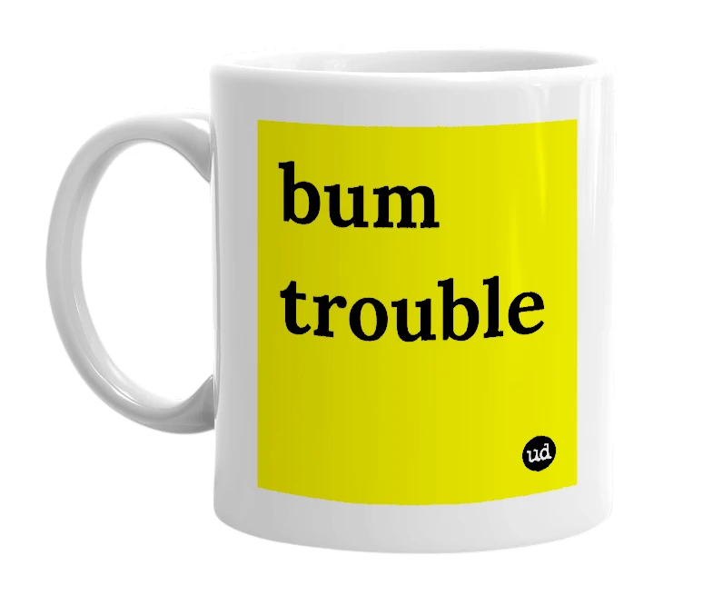 White mug with 'bum trouble' in bold black letters