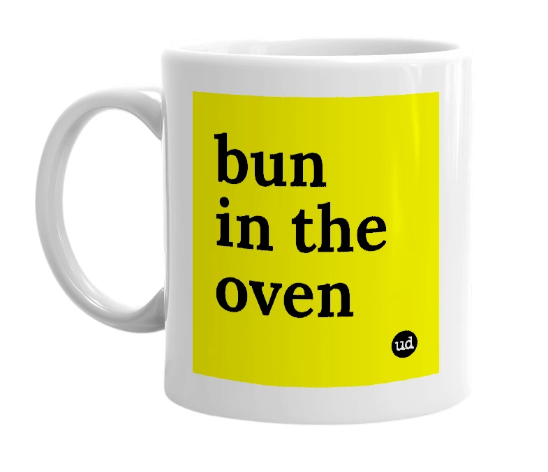 White mug with 'bun in the oven' in bold black letters