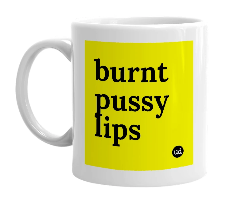 White mug with 'burnt pussy lips' in bold black letters