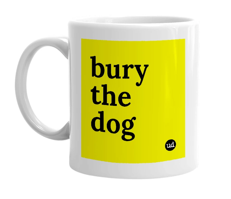 White mug with 'bury the dog' in bold black letters