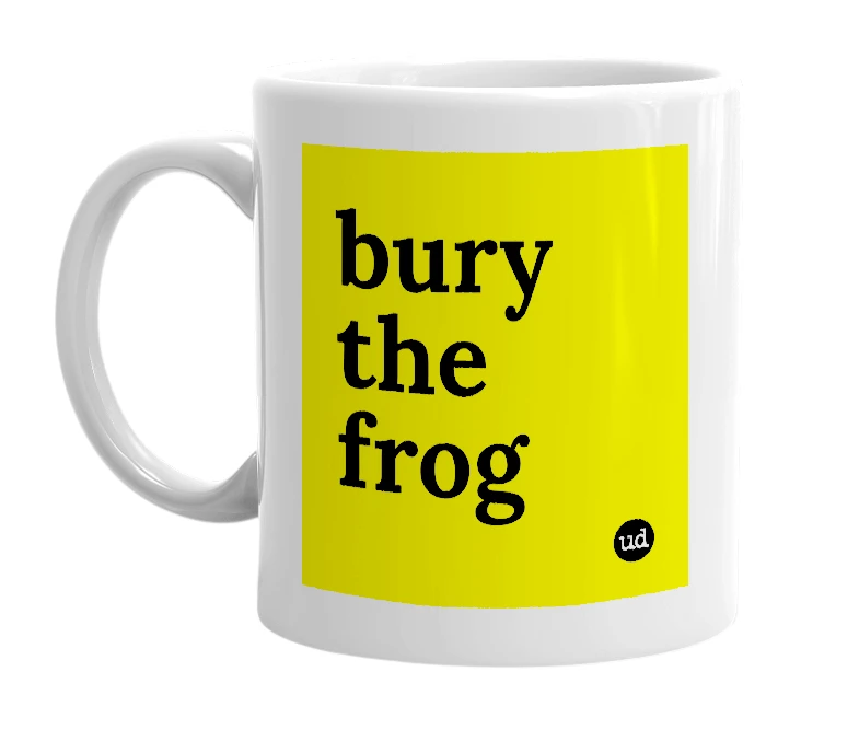 White mug with 'bury the frog' in bold black letters