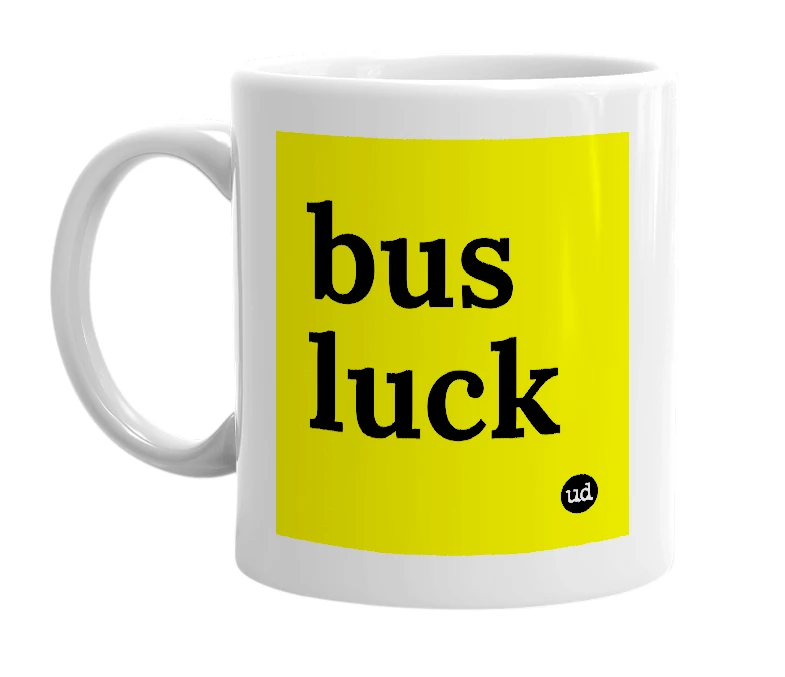 White mug with 'bus luck' in bold black letters