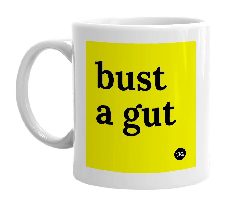 White mug with 'bust a gut' in bold black letters