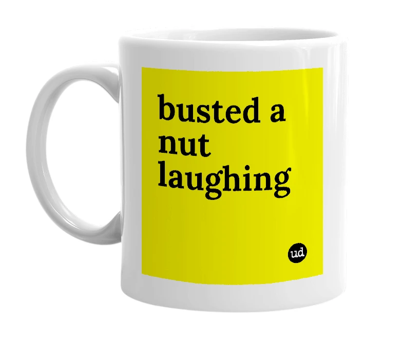 White mug with 'busted a nut laughing' in bold black letters