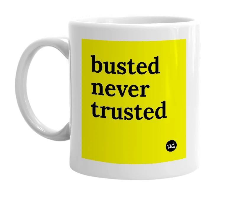 White mug with 'busted never trusted' in bold black letters