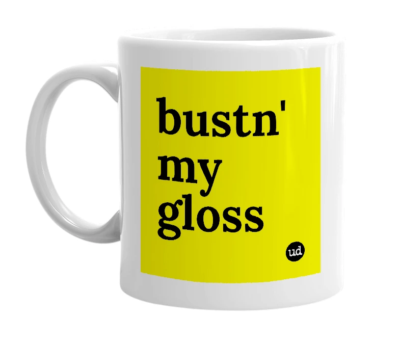 White mug with 'bustn' my gloss' in bold black letters