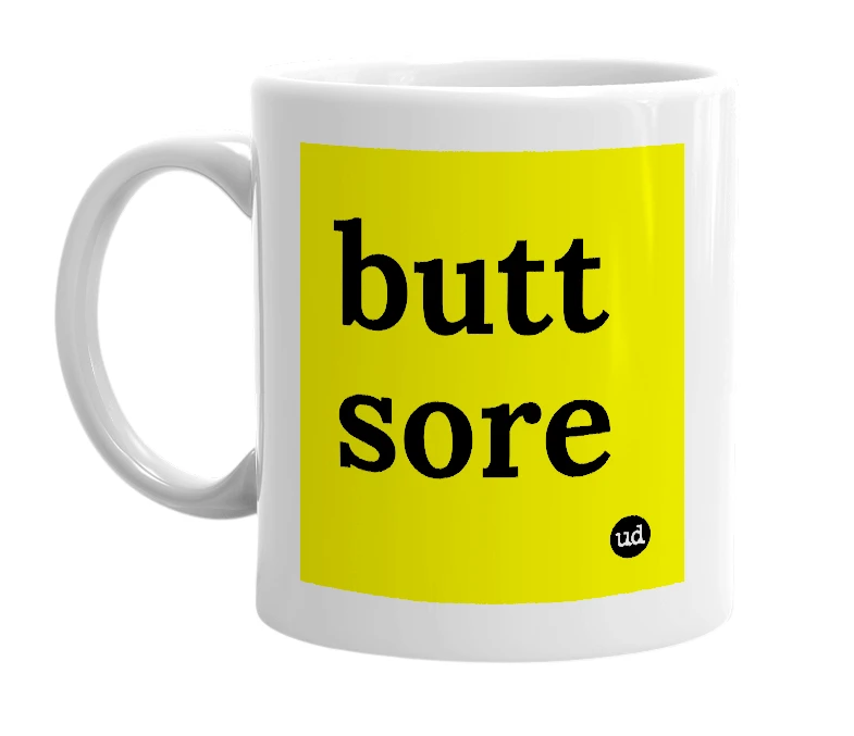 White mug with 'butt sore' in bold black letters