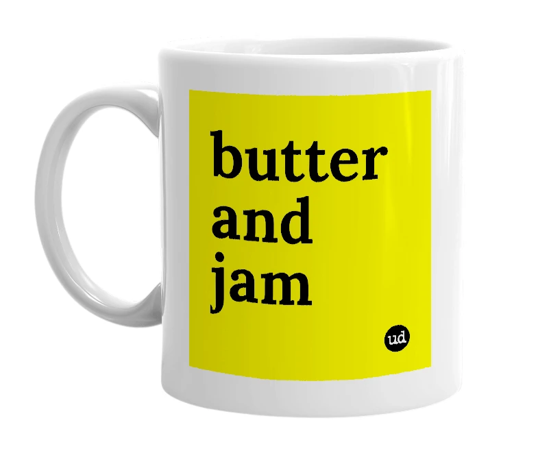 White mug with 'butter and jam' in bold black letters