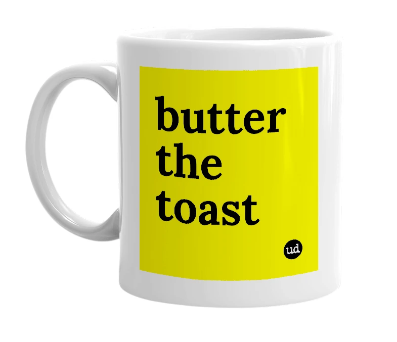 White mug with 'butter the toast' in bold black letters