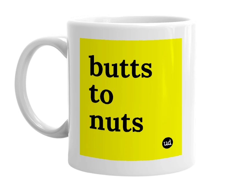 White mug with 'butts to nuts' in bold black letters