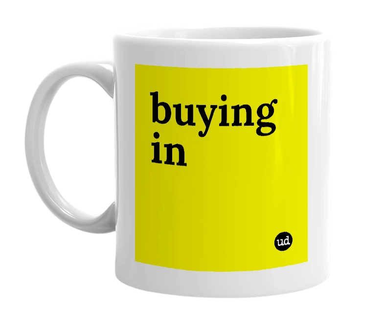 White mug with 'buying in' in bold black letters