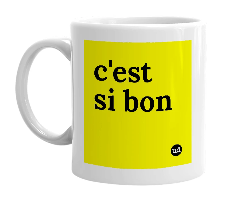 White mug with 'c'est si bon' in bold black letters