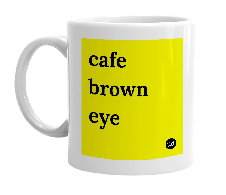 White mug with 'cafe brown eye' in bold black letters