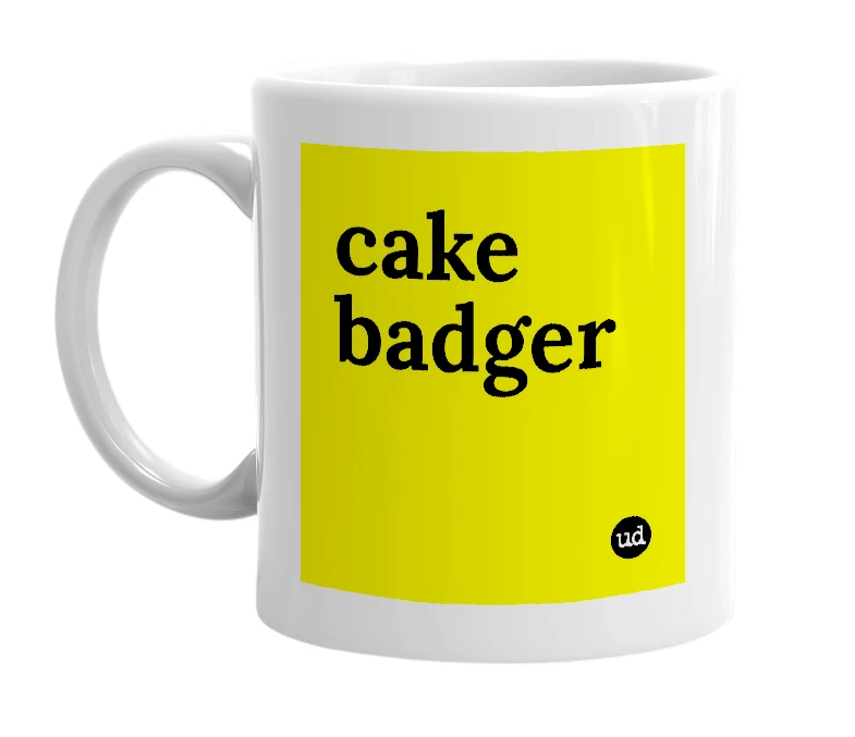 White mug with 'cake badger' in bold black letters