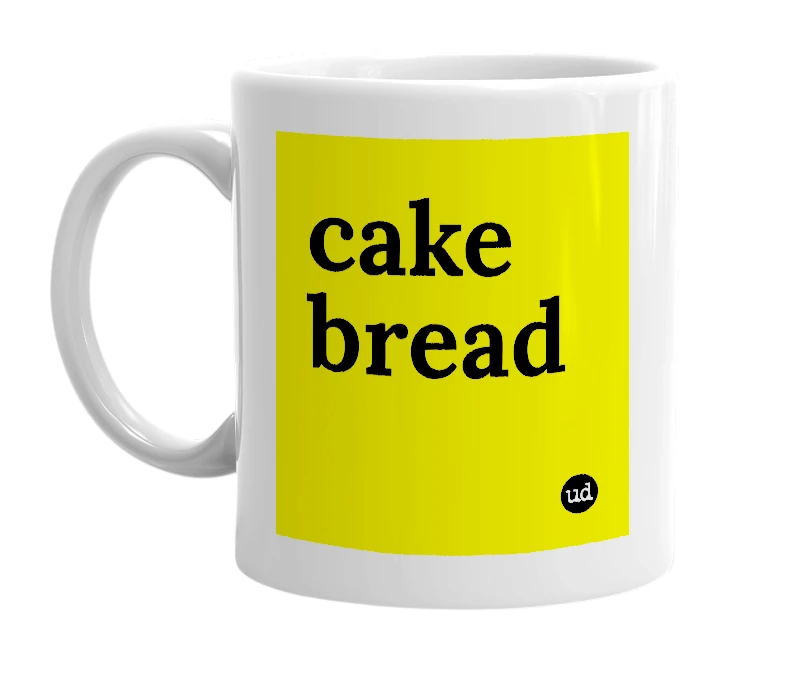 White mug with 'cake bread' in bold black letters