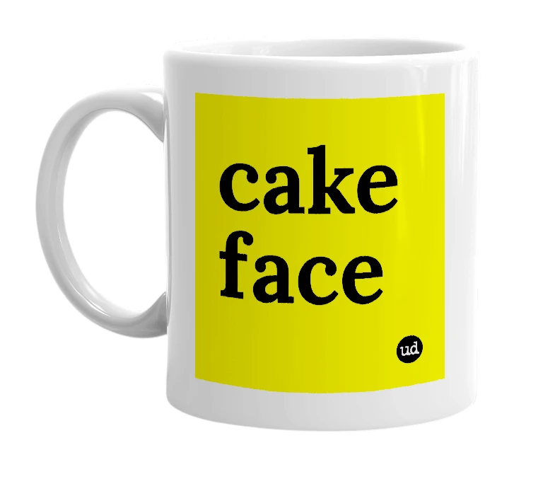 White mug with 'cake face' in bold black letters