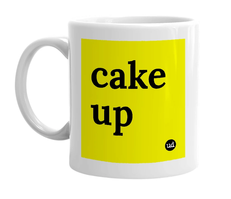 White mug with 'cake up' in bold black letters