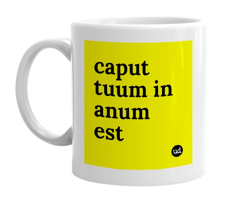 White mug with 'caput tuum in anum est' in bold black letters