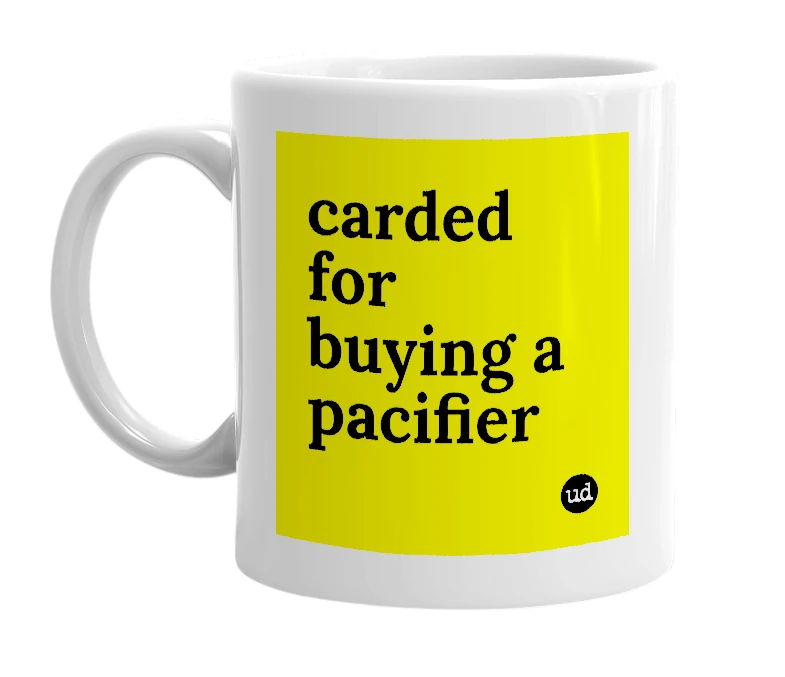 White mug with 'carded for buying a pacifier' in bold black letters