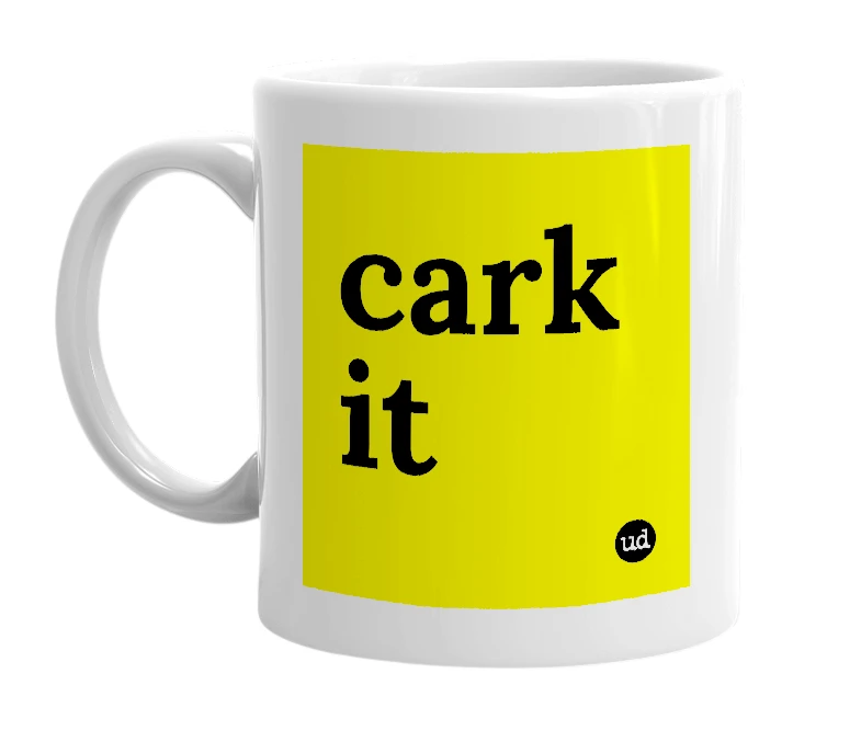 White mug with 'cark it' in bold black letters