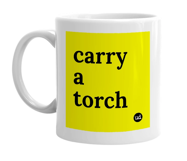 White mug with 'carry a torch' in bold black letters